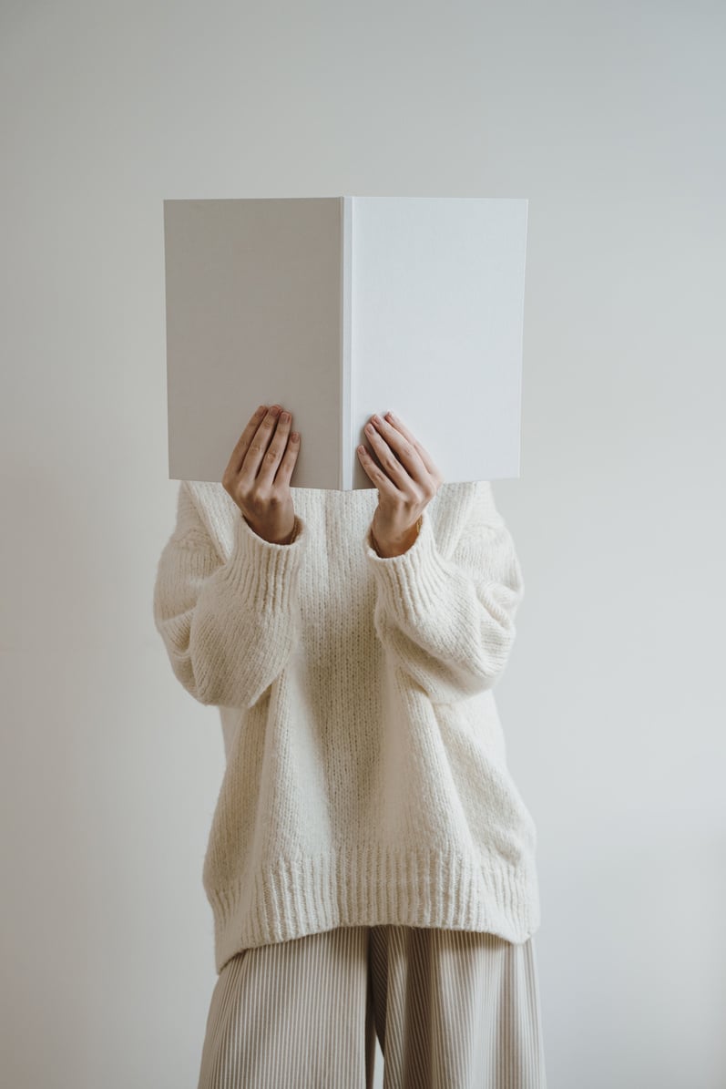 Person Covering Face with Book